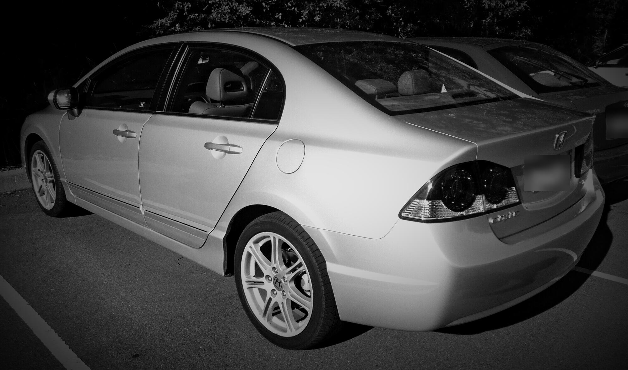 Rear view of a silver 2006–2009 Honda Civic sedan