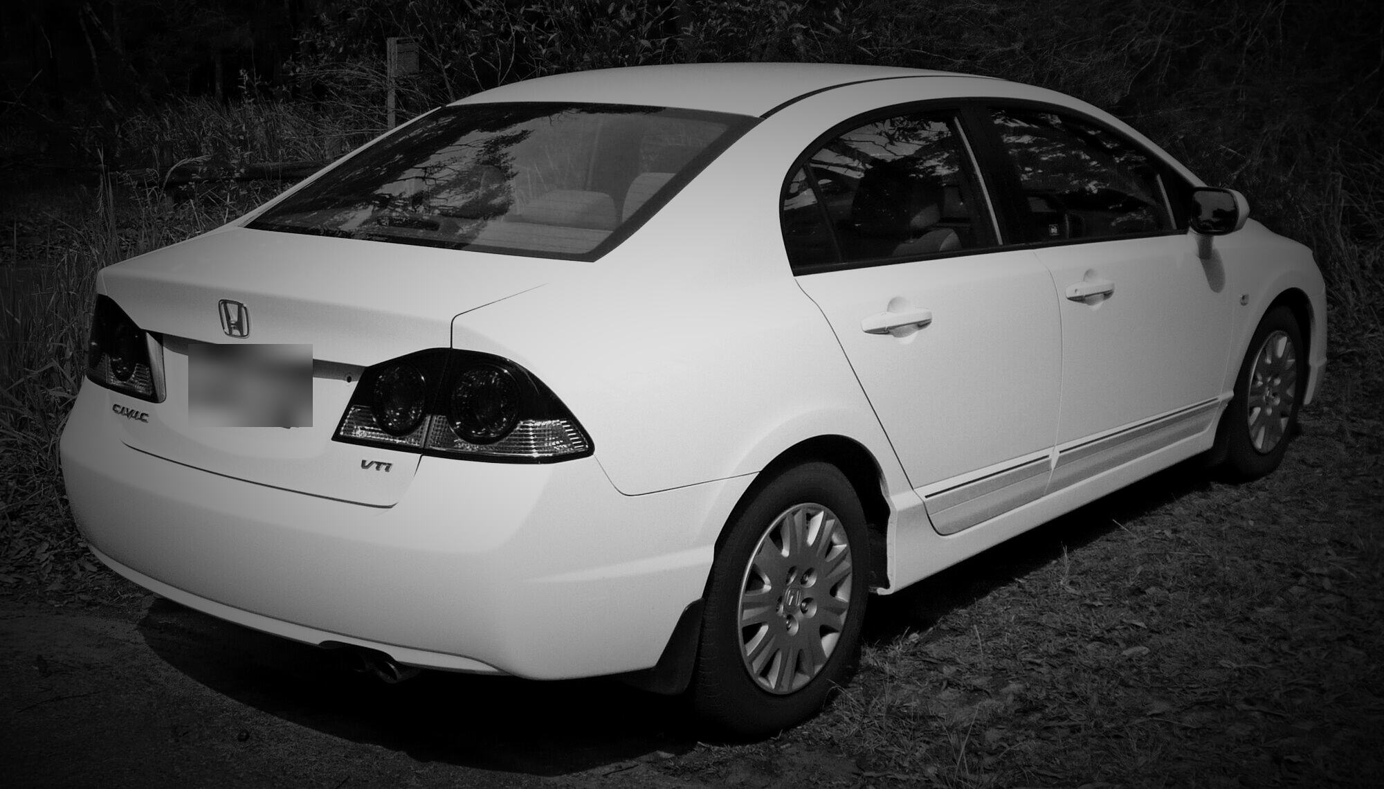 Rear view of a white 2006–2009 Honda Civic sedan